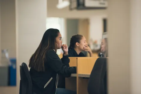 student studying in the library at uccs