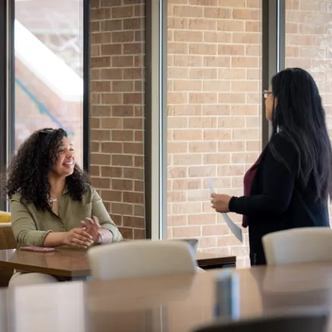 Two students talking in the Career Center