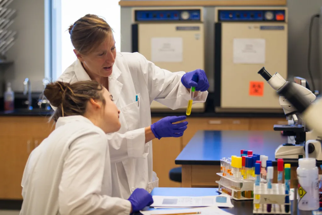 Student and professor working in lab