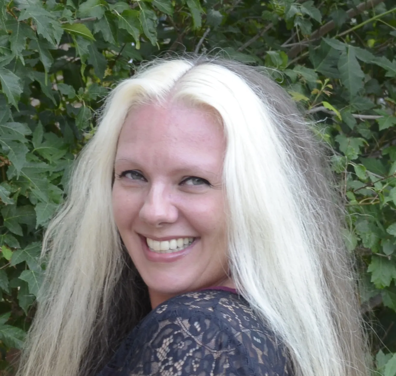 photo of Michaela Steen in front of green foliage
