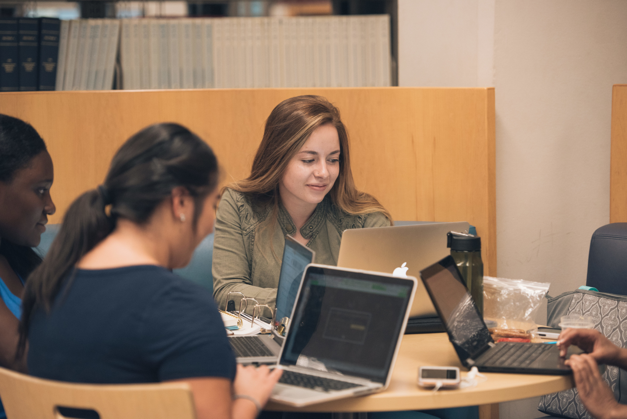 students studying in the library on UCCS campus
